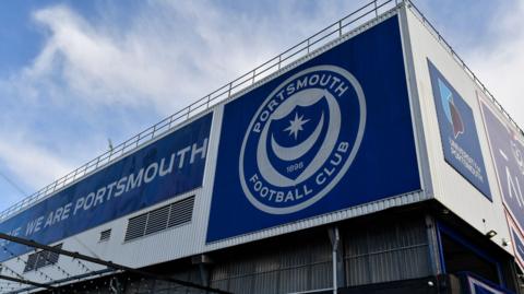 Portsmouth Football Club crest on the outside of a stand at Fratton Park