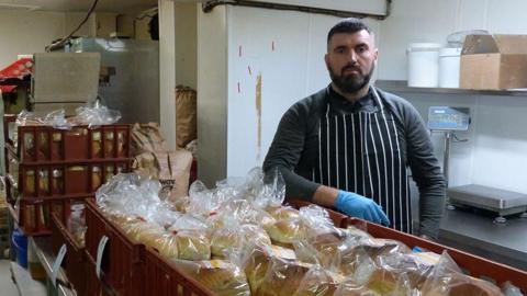 Dewi Roberts with trays of bread