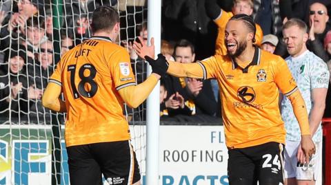 Cambridge goalscorer Ryan Loft celebrates with Jordan Cousins