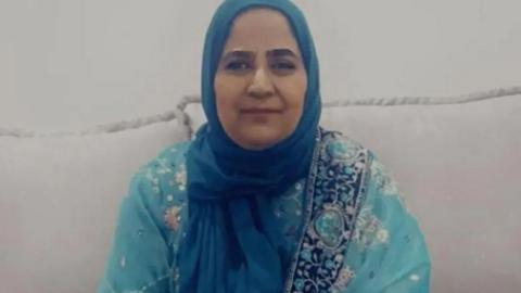 Head and shoulders image of Safia Karieem wearing a blue headscarf