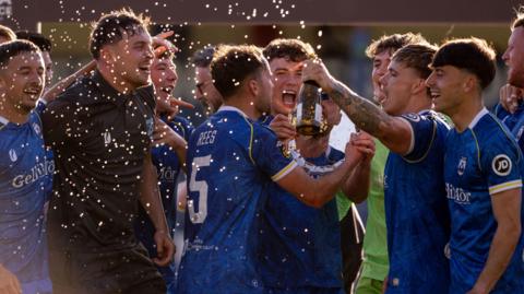 Haverfordwest County celebrate victory in the Cymru Premier European play-off against Caernarfon Town in May