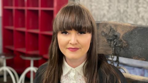 Sian Cullen sitting in her interrogation chair