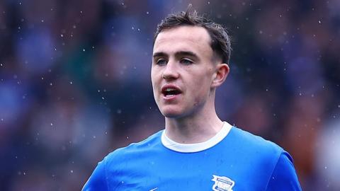 Luke Harris playing for Birmingham on a rainy day 