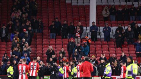 Sheffield United players clap their fans