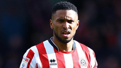 Tyrese Campbell in a red and white shirt of Sheffield United