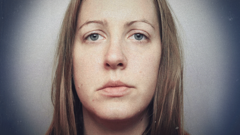 Lucy Letby's police mugshot, with a graphical treatment so she appears in a spotlight with the corners of the image fading to darkness