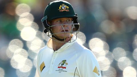 Steve Smith looks back after being dismissed