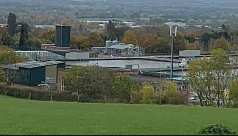 Views of land south of Mount Road in Oswestry show landscape of buildings and green space.