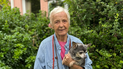 Maggie Jackaman, 80, pictured with charity mascot, Kenny