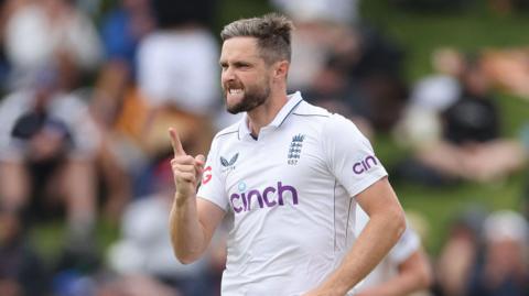 Chris Woakes celebrates a wicket