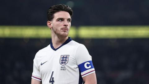 Declan Rice looks on