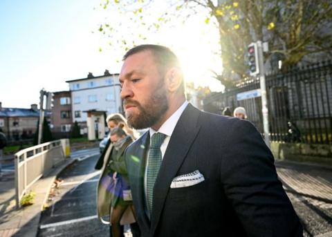 Conor McGregor is pictured in a suit leaving court