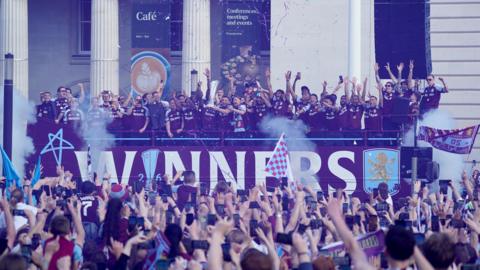 ston Villa players celebrate during the Europa League winners parade in Birmingham