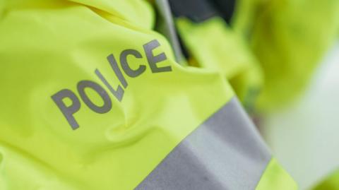 A police officer's high-visibility jacket. 