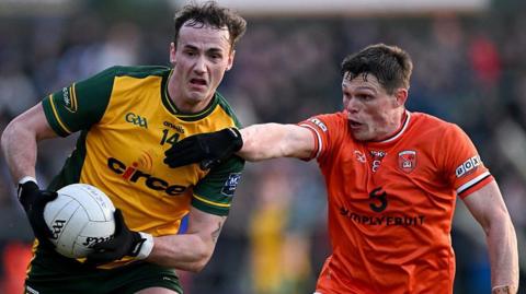 Donegal's Jason McGee is challenged by Callum O'Neill