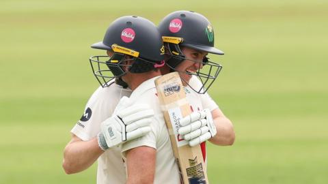 Ben Kellaway of Glamorgan and Colin Ingram of Glamorgan congratulate each other as they both make 100