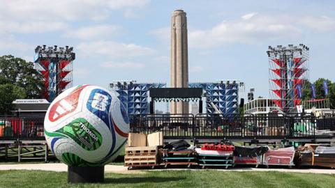 A World Cup football in front of a fan zone being erected for the World Cup in Kansas City.