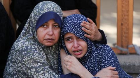 Women react following the death of Palestinians, in what the Gaza health ministry say was Israeli fire near a distribution site in Rafah, at Nasser hospital in Khan Younis, in the southern Gaza Strip, June 3, 202