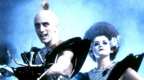 A screenshot from the film featuring Richard O'Brien and Patricia Quinn