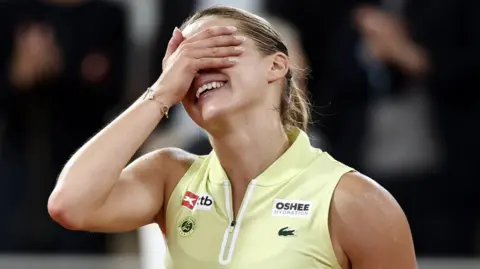 Mirra Andreeva celebrates