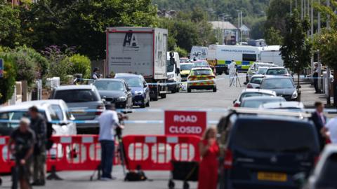 Image shows a police cordon and various emergency vehicles close to the Hart Street studios where the Southport attack took place, on 29 July 2024. 