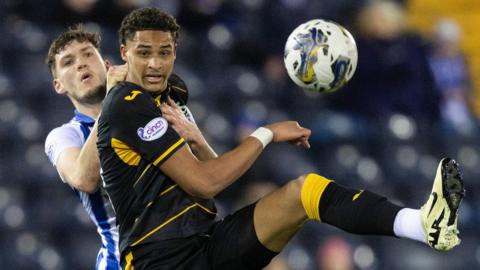 Kilmarnock's Joe Wright and Livingston's Tete Yengi