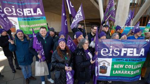 College lecturers from across Scotland gather at a rally outside the Scottish Parliament in Edinburgh following a morning on the picket line