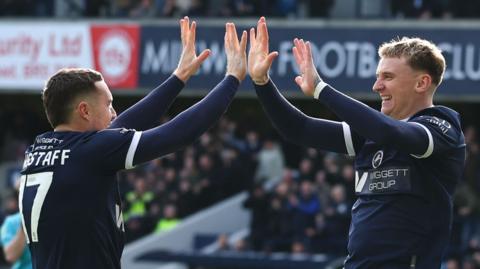 Macaulay Langstaff (left) and Alfie Dougherty celebrate Millwall's opening goal against Charlton Athletic