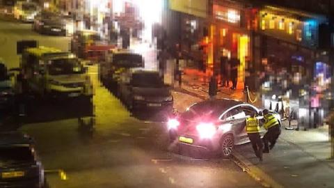 CCTV and body worn video captures a car colliding with two officers 