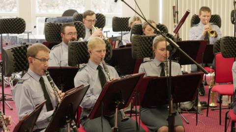 Musicians recording the new march