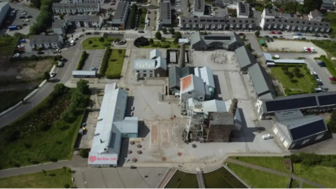 Ariel picture of Heartlands near Redruth. There is an old mine engine housing, a conference centre, shops and cafes.