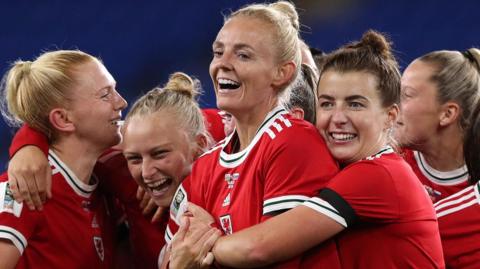 From left: Ceri Holland celebrates with Elise Hughes, Sophie Ingle and Angharad James of Wales