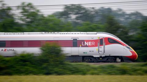 An LNER train travelling along the countryside