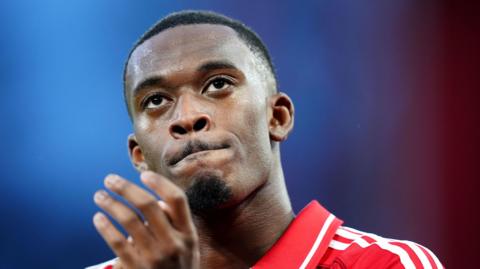Callum Hudson-Odoi clapping in a red Nottingham Forest kit