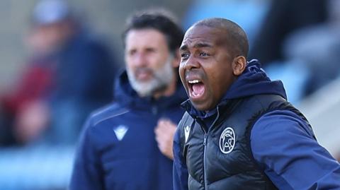Darren Byfield bellows out instructions to his players during a Walsall game