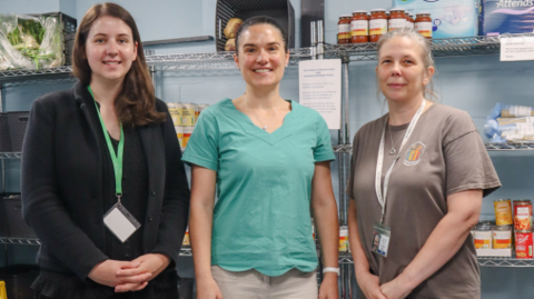 Three women in a food pantry in Cheltenham