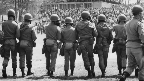Law enforcement officers in a line at Kent State in 1970