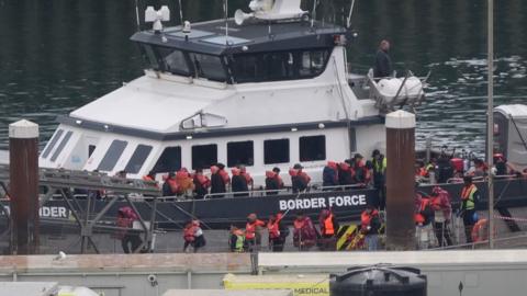 A group of people thought to be migrants are brought in to Dover, Kent, from a Border Force vessel following a small boat incident in the Channel on 21 May 2025