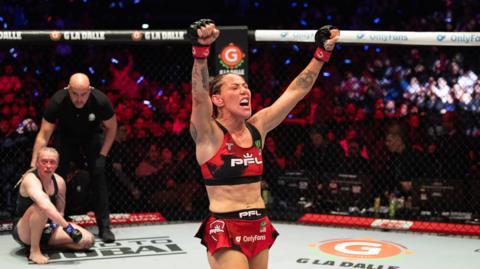 Cris Cyborg celebrates beating Sara Collins