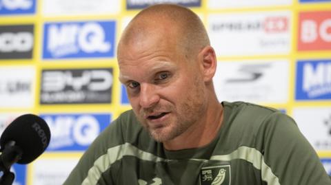 Liam Manning during a pre-match press conference