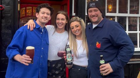 People in front of a pub