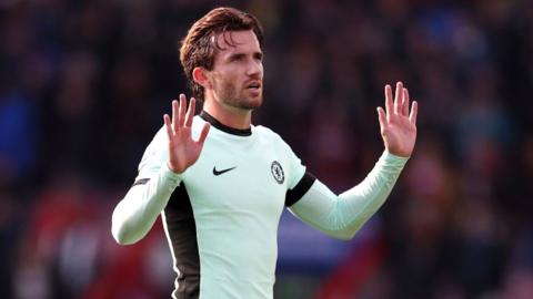 Ben Chilwell holds his arms up