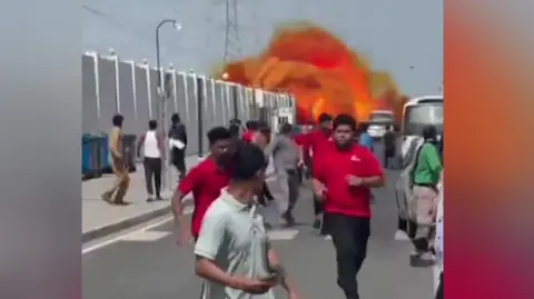 People running from fireball in Doha street