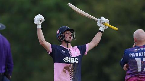 Luke Hollman celebrates Middlesex victory over Durham