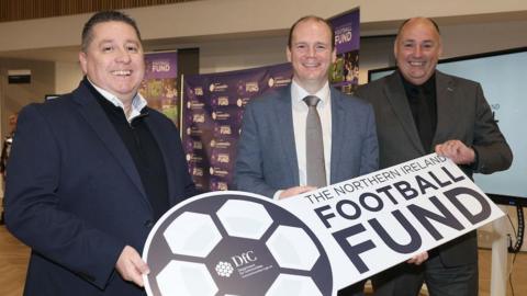 Gordon Lyons (centre) pictured with NIFL chairman Gerard Lawlor and IFA president Conrad Kirkwood 
