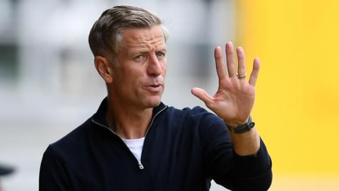 Newport County manager David Hughes gives orders from the touchline