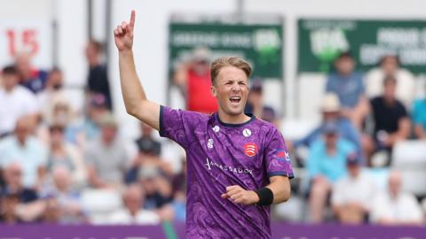 Ben Allison puts his hand in the air after claiming a wicket for Essex in their One-Day Cup match against Glamorgan