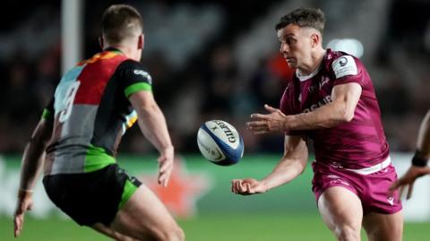 George Ford passes the ball