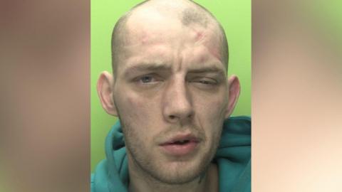 A custody image of Reece Wheat