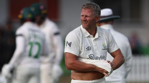 Glamorgan's Timm Van der Gugten gives a rueful sidewards glance as he walks back to his mark against Leicestershire at Grace Road
